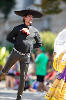 Washington, D.C., USA - September 29, 2018: The Fiesta DC Parade, Mexican man dress up as mariachi dancing