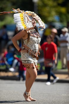 Washington, D.C., USA - September 29, 2018: The Fiesta DC Parade, peruvian woman wearing traditional clothing danicng during the parade
