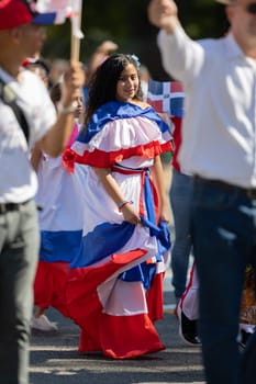 Washington, D.C., USA - September 29, 2018: The Fiesta DC Parade, Woman wearing traditional clothing from the Dominican Republic