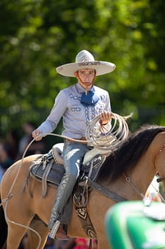 Washington, D.C., USA - September 29, 2018: The Fiesta DC Parade, Man wearing traditional mexican clothing riding a horse