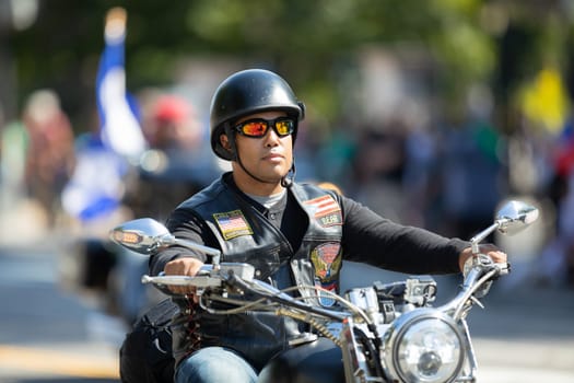 Washington, D.C., USA - September 29, 2018: The Fiesta DC Parade, Man from el Puerto Rico riding a motorcycle Members of the latin american motorcycle association