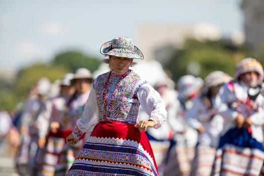 Washington, D.C., USA - September 29, 2018: The Fiesta DC Parade, Peruvian women wearing traditional clothing danicng during the parade