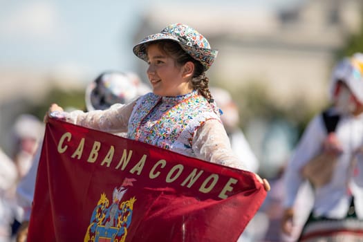 Washington, D.C., USA - September 29, 2018: The Fiesta DC Parade, Peruvian women wearing traditional clothing danicng during the parade