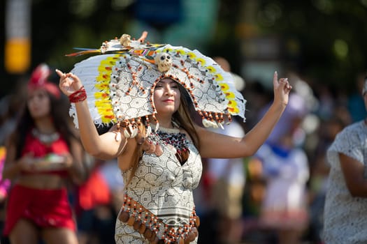 Washington, D.C., USA - September 29, 2018: The Fiesta DC Parade, peruvian woman wearing traditional clothing danicng during the parade