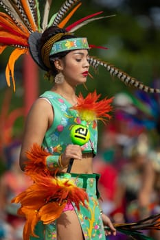 Milwaukee, Wisconsin, USA - September 8, 2018 The Indian Summer Festival: Men women and children members of the Dance Academy of Mexico performing Aztec Dance