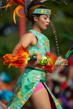 Milwaukee, Wisconsin, USA - September 8, 2018 The Indian Summer Festival: Men women and children members of the Dance Academy of Mexico performing Aztec Dance