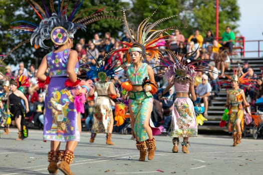 Milwaukee, Wisconsin, USA - September 8, 2018 The Indian Summer Festival: Men women and children members of the Dance Academy of Mexico performing Aztec Dance