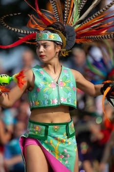 Milwaukee, Wisconsin, USA - September 8, 2018 The Indian Summer Festival: Men women and children members of the Dance Academy of Mexico performing Aztec Dance