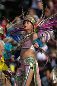 Milwaukee, Wisconsin, USA - September 8, 2018 The Indian Summer Festival: Men women and children members of the Dance Academy of Mexico performing Aztec Dance
