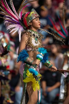 Milwaukee, Wisconsin, USA - September 8, 2018 The Indian Summer Festival: Men women and children members of the Dance Academy of Mexico performing Aztec Dance