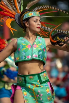 Milwaukee, Wisconsin, USA - September 8, 2018 The Indian Summer Festival: Men women and children members of the Dance Academy of Mexico performing Aztec Dance