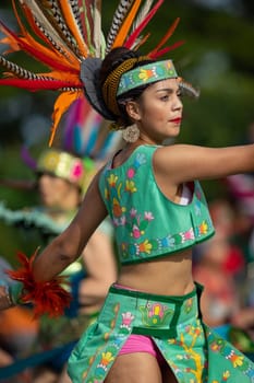 Milwaukee, Wisconsin, USA - September 8, 2018 The Indian Summer Festival: Men women and children members of the Dance Academy of Mexico performing Aztec Dance