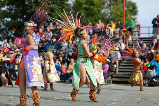 Milwaukee, Wisconsin, USA - September 8, 2018 The Indian Summer Festival: Men women and children members of the Dance Academy of Mexico performing Aztec Dance