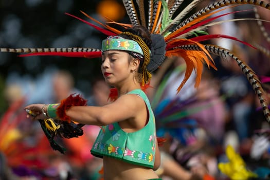 Milwaukee, Wisconsin, USA - September 8, 2018 The Indian Summer Festival: Men women and children members of the Dance Academy of Mexico performing Aztec Dance