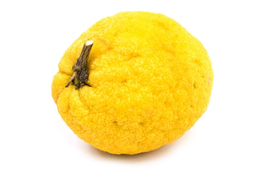 Lemon,huge yellow fruit against a white background