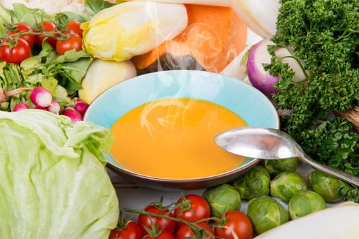 plate of pumpkin soup with  several vegetables