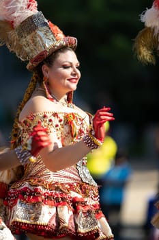 Washington, D.C., USA - September 29, 2018: The Fiesta DC Parade, Bolivian women wearing traditional clothing performing a traditional dance from bolivia