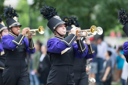 Washington, D.C., USA - May 28, 2018: The National Memorial Day Parade, Members of GWB Golden Wolf Marching Band, going down Constitution Avenue during the parade