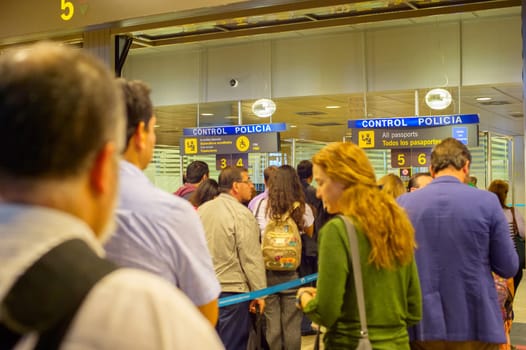 MADRID, SPAIN - MAY 23, 2017: People queue on passport control at arrival, Madrid airport, Spain