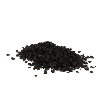 Pile of black salt isolated on white.
