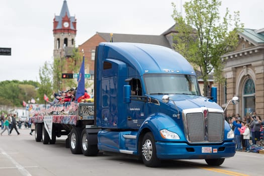 Stoughton, Wisconsin, USA - May 20, 2018: Annual Norwegian Parade, Military Veterans transported by a semi-truck during the parade