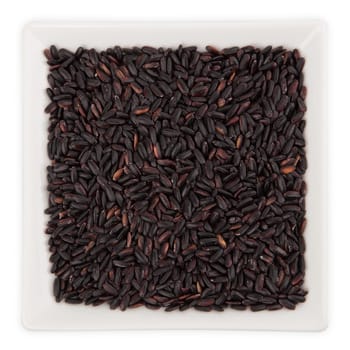 Black Rice in a Bowl isolated on white background