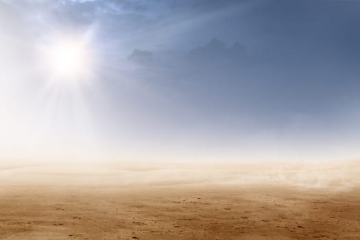 Views of desert with sunlight over dark sky background