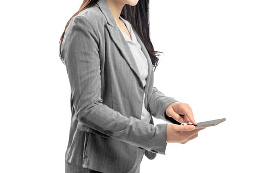 Business woman touch the mobile phone screen posing isolated over white background