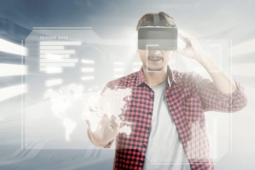 Asian man touching world map on digital interface with virtual reality device display the world map, graphic bar and binary code. Augmented reality technology