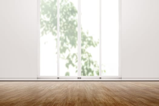 Interior room with wooden floor and white wall with window glass over outdoors background