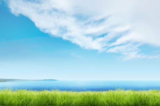 Green grass with blue ocean view and cloudscapes over blue sky background