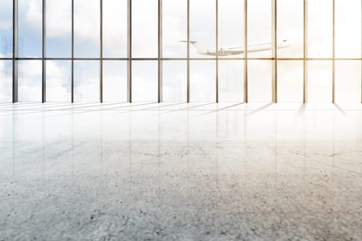 Empty airport hall with window of glass and flying airplane over blue sky background