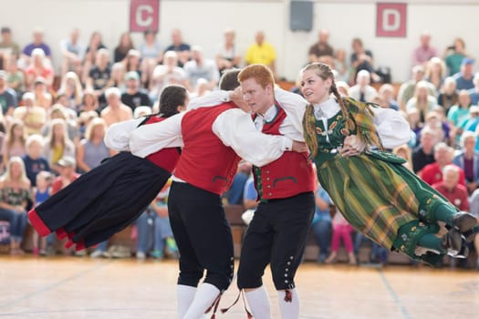 Stoughton, Wisconsin, USA - May 19, 2018 The Stoughton Norwegian Dancers, wearing traditional clothing from norway, perform traditional dances at the Community Building Performance, during the Syttende Mai Stoughton festival, Norwegian Constitution Day.