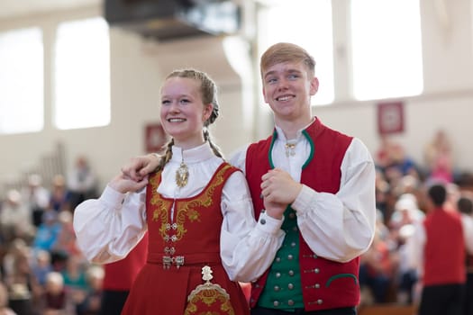 Stoughton, Wisconsin, USA - May 19, 2018 The Stoughton Norwegian Dancers, wearing traditional clothing from norway, perform traditional dances at the Community Building Performance, during the Syttende Mai Stoughton festival, Norwegian Constitution Day.