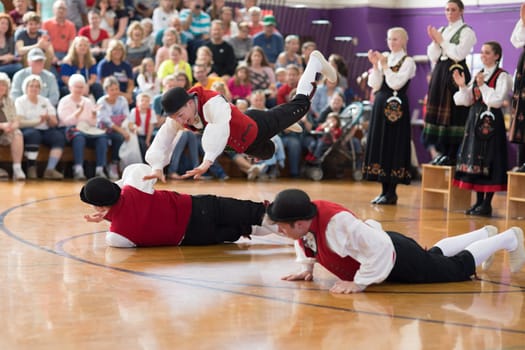 Stoughton, Wisconsin, USA - May 19, 2018 The Stoughton Norwegian Dancers, wearing traditional clothing from norway, perform traditional dances at the Community Building Performance, during the Syttende Mai Stoughton festival, Norwegian Constitution Day.