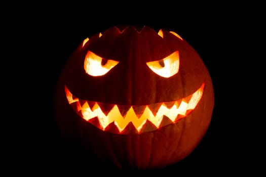 The big helloween symbol has a mad face glowing eyes and also a glow in its mouth and teeth. Black orange nightmare of October 31st.