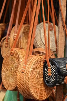 Balinese handmade rattan eco bags in a local souvenir market in Bali, Indonesia
