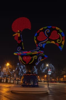BARCELOS, PORTUGAL - CIRCA JAUARY 2019: View at the Pop Galo at night, public art inspired in the Barcelos cock, cosidered one of the most important symbols of Portuguese popular culture.