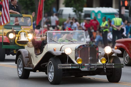 Louisville, Kentucky, USA - May 03, 2018: The Pegasus Parade, Members of Kosair Shriners, driving sand bugs down W Broadway