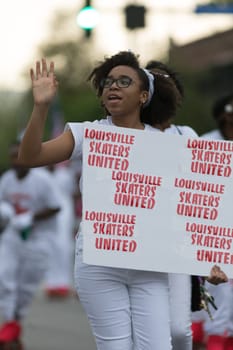 Louisville, Kentucky, USA - May 03, 2018: The Pegasus Parade, Members of the Louisville Skaters United, on roller skates dancing, during the parade