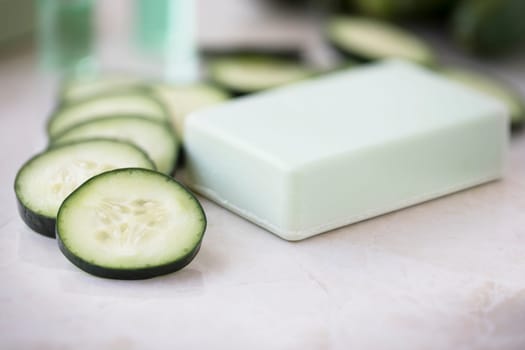 Cucumber slices and soap with cucumber extract.