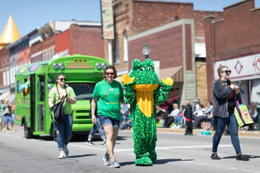 Orleans, Indiana, USA - April 28, 2018: The Orleans DogWood Festival and Parade, person in a frog costume promoting Frog Street