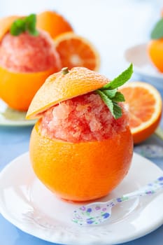 Refreshing orange sorbet served in a fresh blood orange