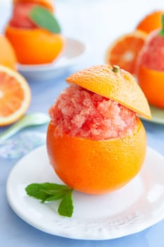 Refreshing orange sorbet served in a fresh blood orange