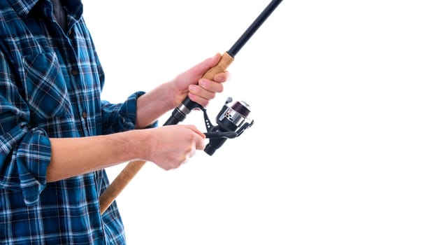 man with fishing rod and blue plaid shirt in front of white background