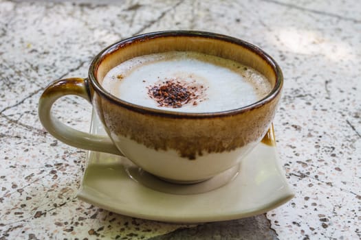 Close up cappuccino coffee on marble table