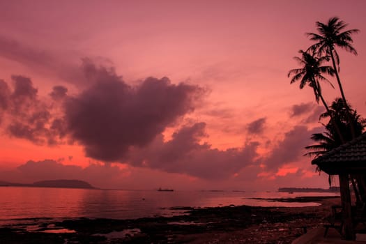 beautiful sunrise on beach and tropical sea in summer