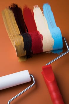 Metal tin cans with color paint and paintbrush