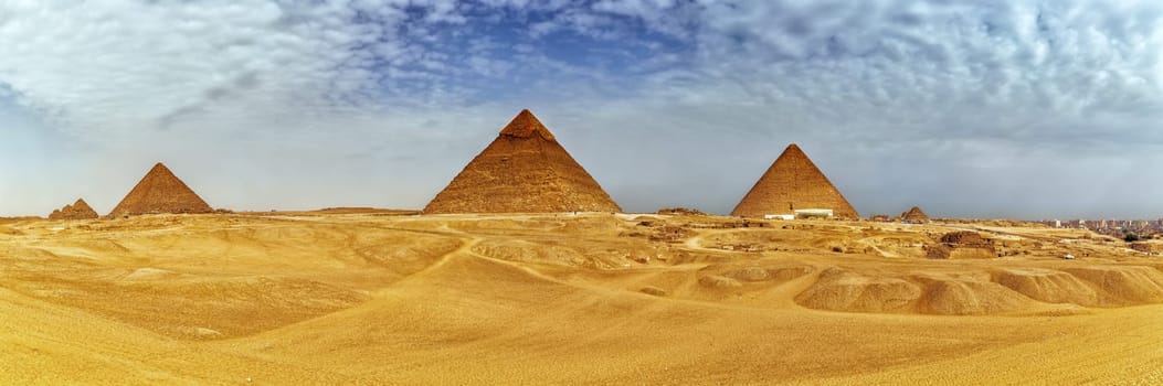 Panorama of the Giza Pyramids in the desert, Egypt.