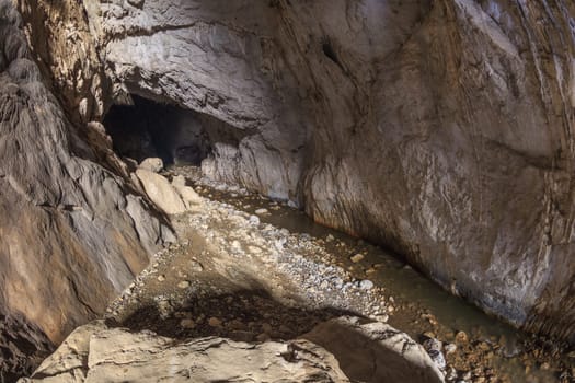 Ponicova cave entrance in the left bank of the Danube in Ciucaru Mare Mountain, Romania